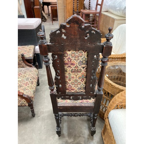 192 - 2x 17th century style carved oak hall chairs 47W and a carved mahogany reading chair 65W