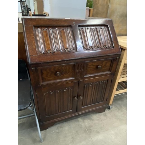 152 - Oak linen fold bureau 100H 76W 42D