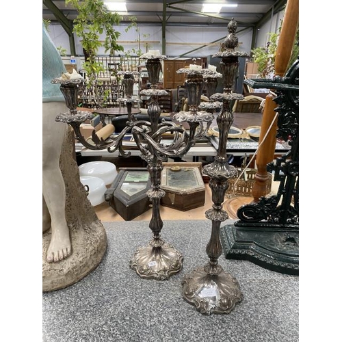 298 - Silver plated 4 branch candelabra & a single candlestick