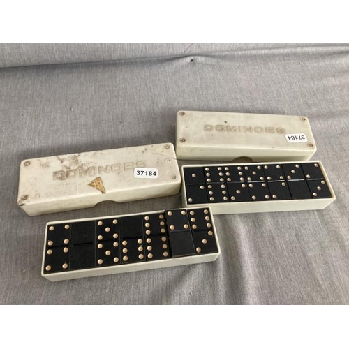 402 - 2 cased sets of dominoes