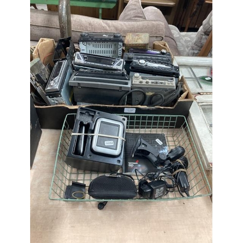 498 - 2 containers of vehicle radio/multi function audio systems (all sold as seen)and a tom tom Go (in wo... 