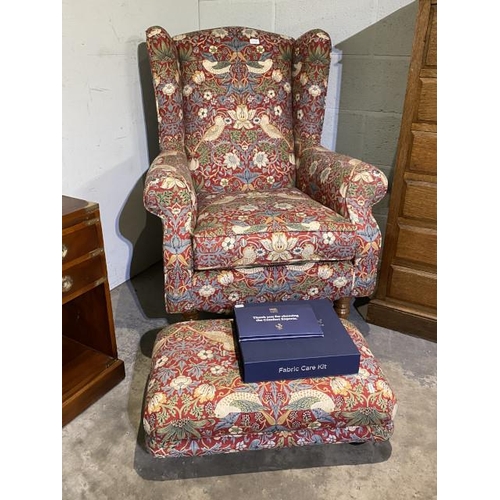 150 - HSL wing armchair upholstered in William Morris 'Strawberry Thief' fabric 85W and a matching footsto... 