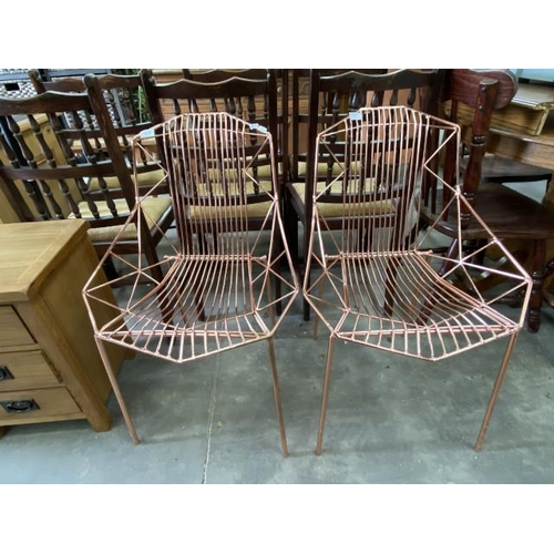 210 - Pair of contemporary wire work copper effect chairs 53W