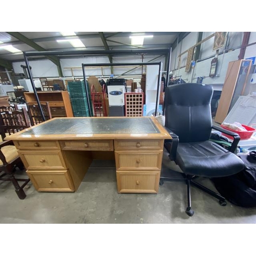 226 - Oak effect writing desk with green leather inset 76H 150W 71D and a black swivel office chair