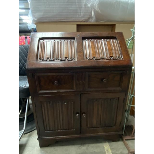 57 - Oak linen fold bureau 100H 76W 42D