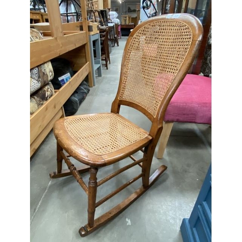 106 - Victorian walnut framed balloon back Bergere rocking chair 43W