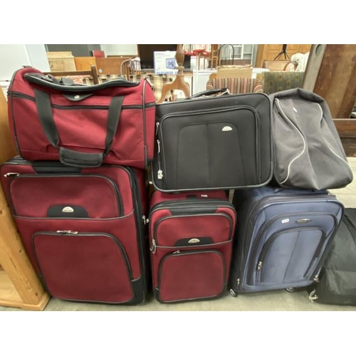 134 - Assorted luggage cases including Samsonite and 2 Kelty Redwing 36 rucksacks