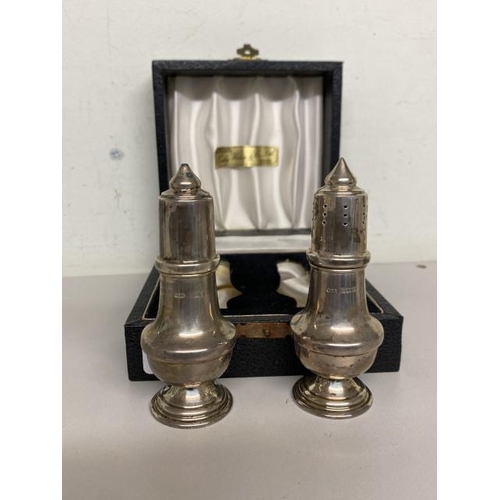 243 - W I Broadway & Co, Birmingham 1984 silver salt & pepper (combined weight 69.7g) 10cm high with prese... 