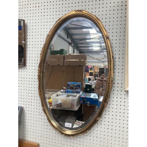 311 - Gilt framed bevel edged oval mirror 70x42cm