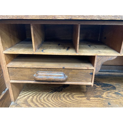 1 - 1930's oak roll top desk with tambour front and two keys 112H 91W 67D and a piano stool 64H 62W 30D