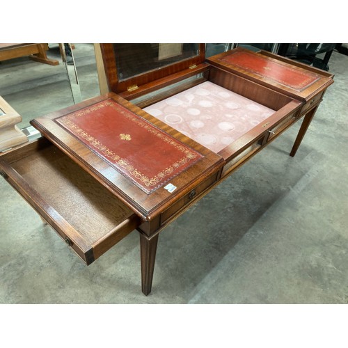 437 - A good quality mahogany leather top coffee table with 2 drawers and lift up glass top with one key 4... 