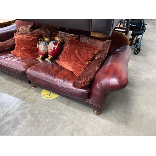 178 - Tetrad burgundy leather settee with scatter cushions 260W (splits into 2 sections) & two urns