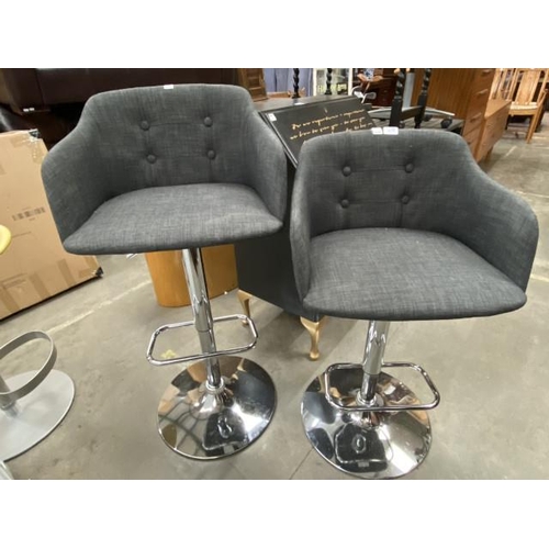 116 - 2 contemporary chrome based swivel bar stools upholstered in grey linen fabric 106H 52W 46D