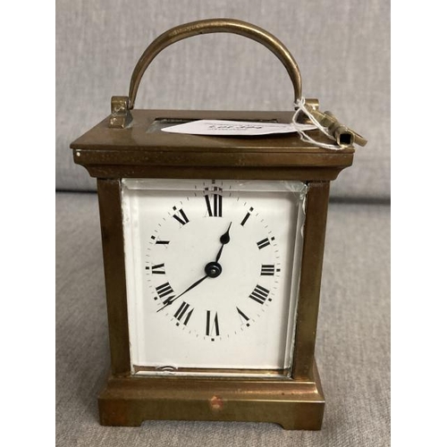 Brass cased carriage clock with key & leather travel case