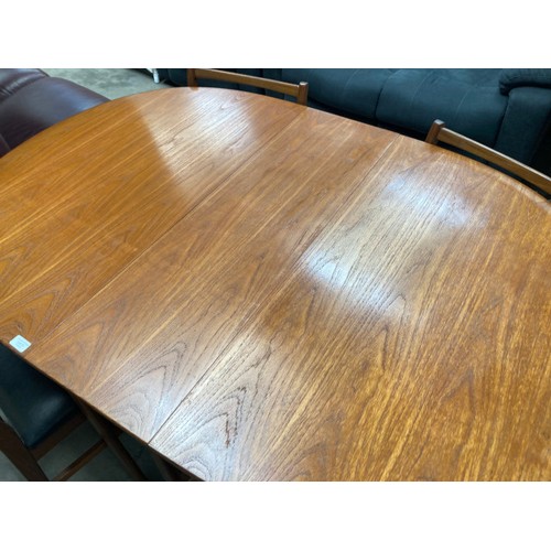 21 - Mid century teak Danish drop leaf table 73H 30-150W 106D and 4 matching chairs