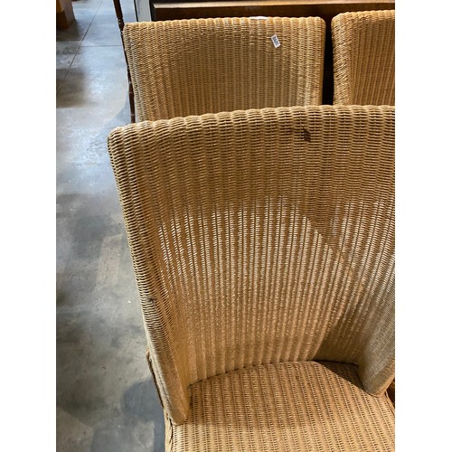 37 - 6 Lloyd Loom ‘Parabola’ dining chairs with cream removable seat pads 46W