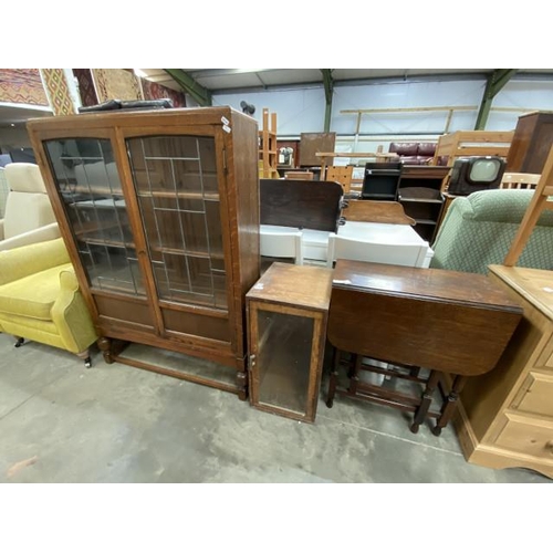 105 - Edwardian oak glazed bookcase 129H 91W 25D, an oak glazed cupboard 65H 33W 41D & an oak gate leg tab... 