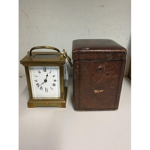 254 - Brass cased carriage clock with key & leather travel case