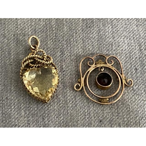 265 - 2 9ct gold and gem set pendants (combined weight 4.7g)