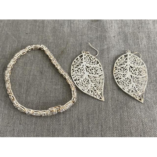 277 - Pair of silver 'Leaf' design earrings and a silver and gem set bracelet (19cm)