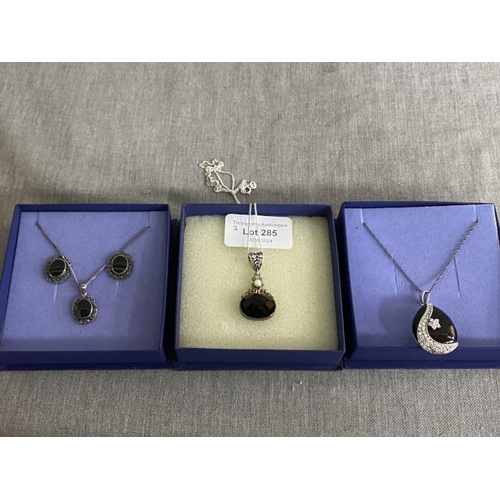 285 - 2 silver and gem set pendants on silver chains (44cm & 46cm) and a silver and gem set pendant on a s... 