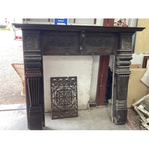 413 - Edwardian mahogany carved fire surround 138H 163W 28D & an architectural cast metal panel 68H 42W