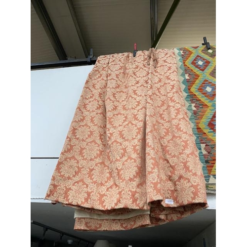 78 - Pair of terracotta lined curtains 400cm wide x 250cm drop