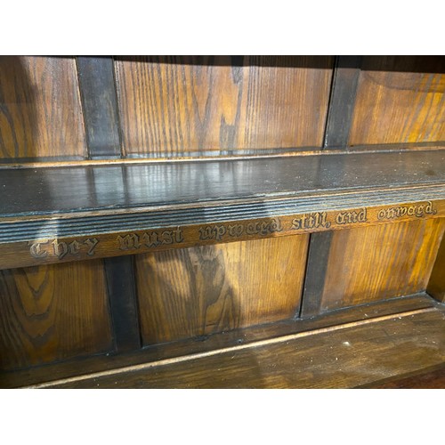 74 - Arts & Crafts oak open bookcase with wording from the poem ‘The Present Crisis’ by James Russell Low... 