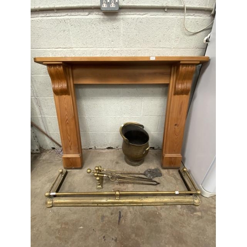 110 - Pine fire surround 112H 145W 21D, brass coal scuttle, brass fire irons and brass extending fender 13... 