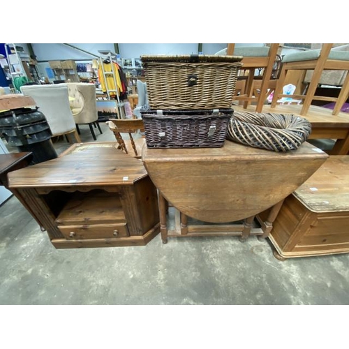 149 - Pine media stand 60H 92W 52D, oak drop leaf table 77H 45-144W 94D, 2 wicker hampers and a wicker hea... 