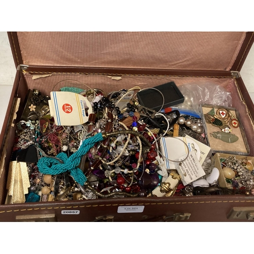 321 - Vintage travel case of jewellery inc. marcasite, costume, paste, enamel badges etc.