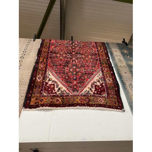 63 - Red ground Persian rug 177 x 105cm