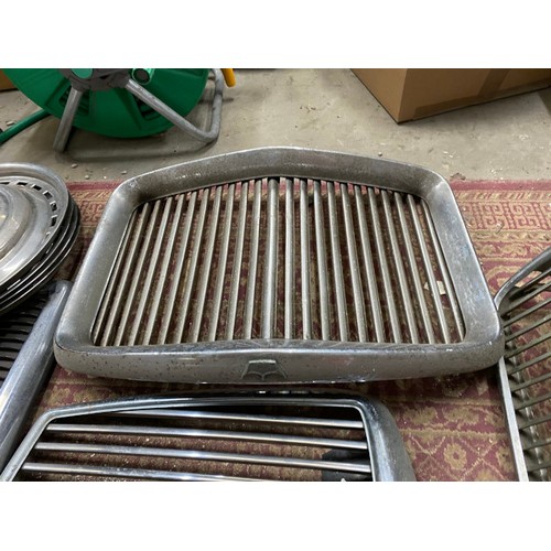 541 - Box of vintage car Grills including Rover, Wolseley etc and a box of vintage car parts including chr... 