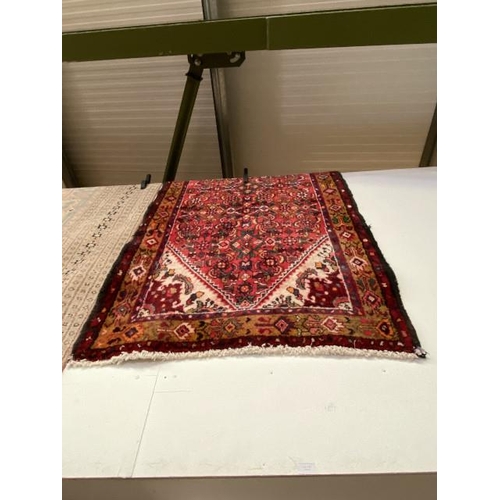 127 - Red ground Persian rug 177 x 105cm