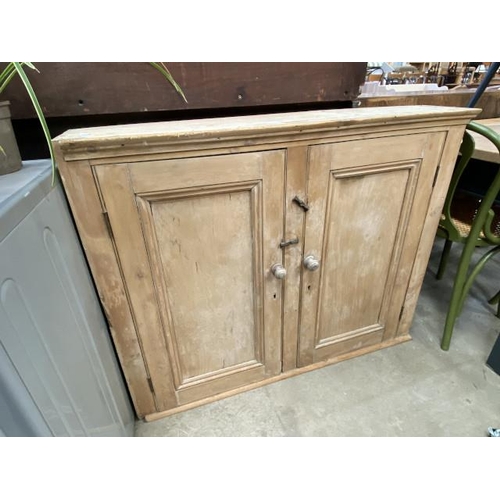 96 - Victorian pine wall mounted two door cupboard with shelves to the interior 89H 112W 22D