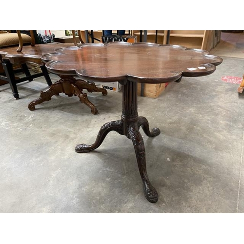 89 - George lll mahogany tilt top table with carved central column and lions head to feet 62H 80cm diamet... 