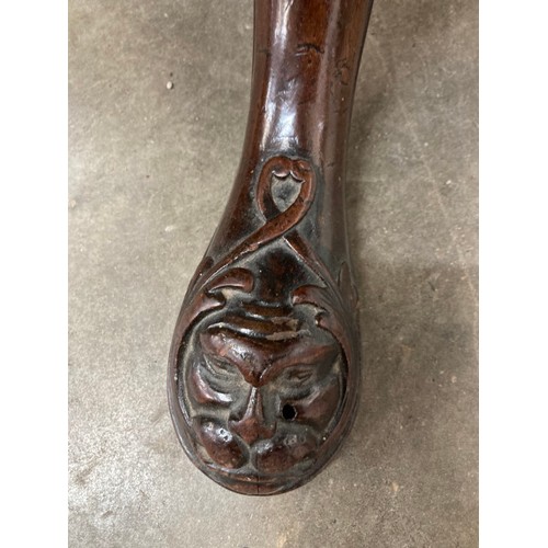 89 - George lll mahogany tilt top table with carved central column and lions head to feet 62H 80cm diamet... 