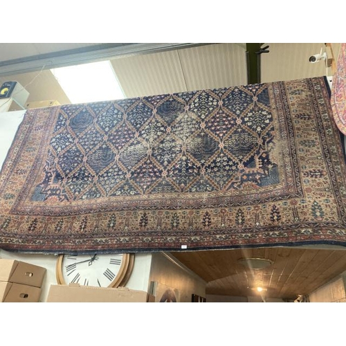 419 - Antique Persian carpet (worn in places/ tears, sold as seen) 390 x 320cm