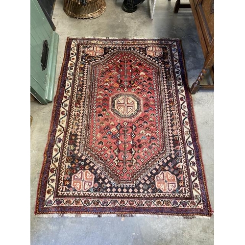 43 - Red ground Persian rug 116 x 115cm