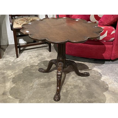 89 - George lll mahogany tilt top table with carved central column and lions head to feet 62H 80cm diamet... 