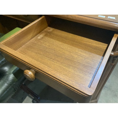 60 - A limited edition Ercol elm 'Roxburghe Desk', number 192 of 250 with brass plaque to inside drawer a... 