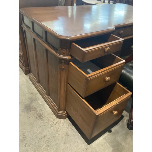 60 - A limited edition Ercol elm 'Roxburghe Desk', number 192 of 250 with brass plaque to inside drawer a... 