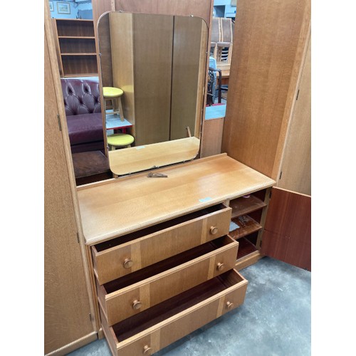 141 - Mid century ‘Meredew’ blond oak wardrobe, with hanging rail to the interior 176H 92W 53D and a match... 