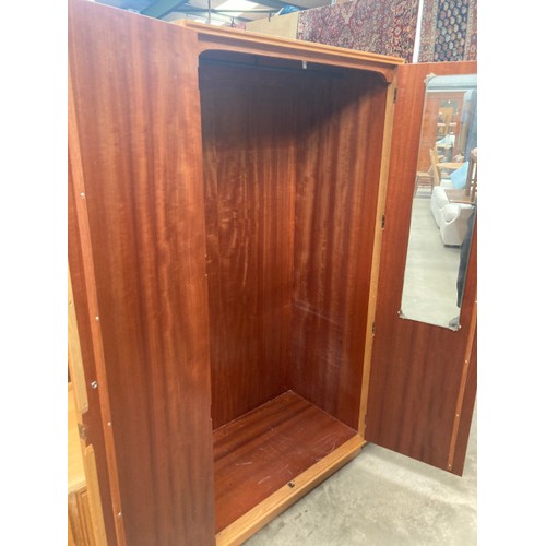 142 - Mid century ‘Meredew’ blond oak wardrobe, with hanging rail to the interior 176H 92W 53D and a match... 