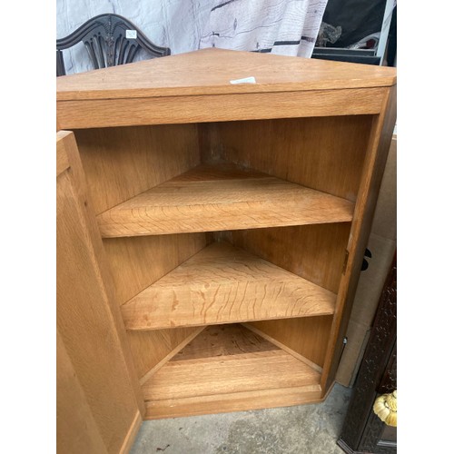 70 - Art Deco French oak corner cupboard (possibly by Charles Dudouyt) with one key 89H 64W 38D