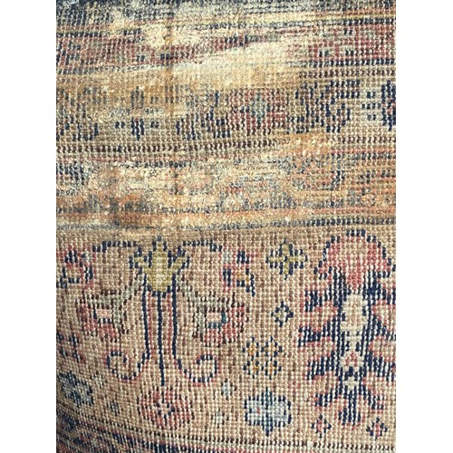 419 - Antique Persian carpet (worn in places/ tears, sold as seen) 390 x 320cm