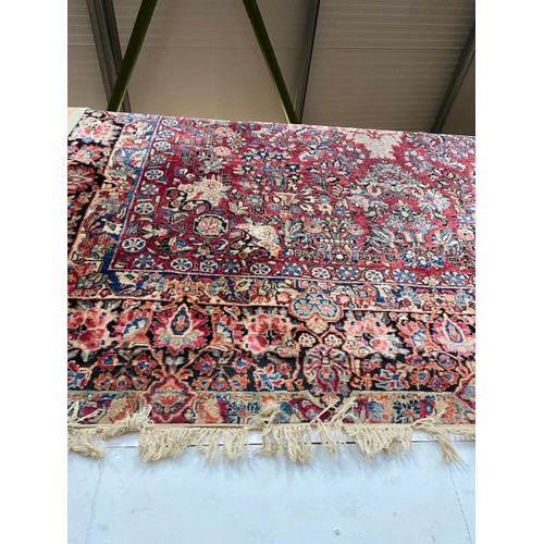 427 - Red ground Persian rug 440 x 315cm (as found)