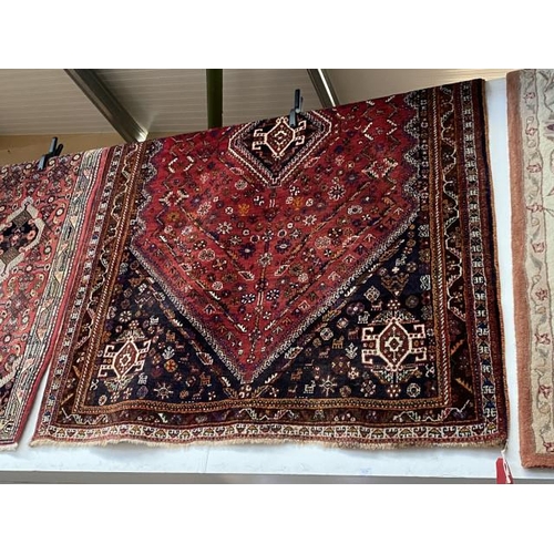 104 - Red ground Persian carpet 260 x 173cm