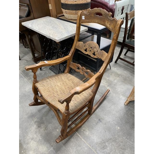 176 - Spanish olive wood rocking chair with rush seat 57W 90D