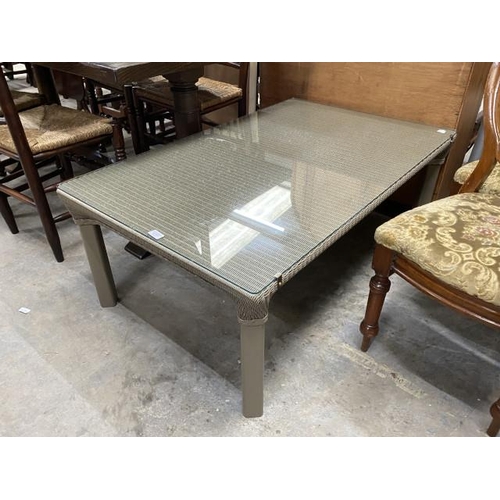 215 - Lloyd Loom of Spalding 'Buxton' coffee table with tempered glass top 45H 120W 75D (in excellent cond... 